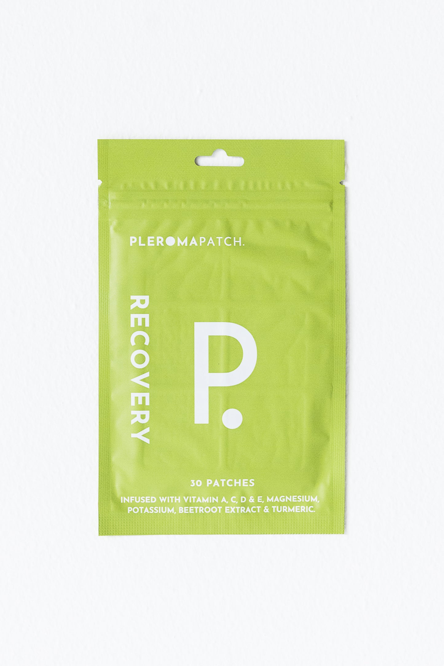 A green package of Pleroma Hangover Recovery Patches, labeled 'RECOVERY P.' with 30 patches inside, designed to alleviate hangover symptoms with a blend of vitamins and herbal extracts.