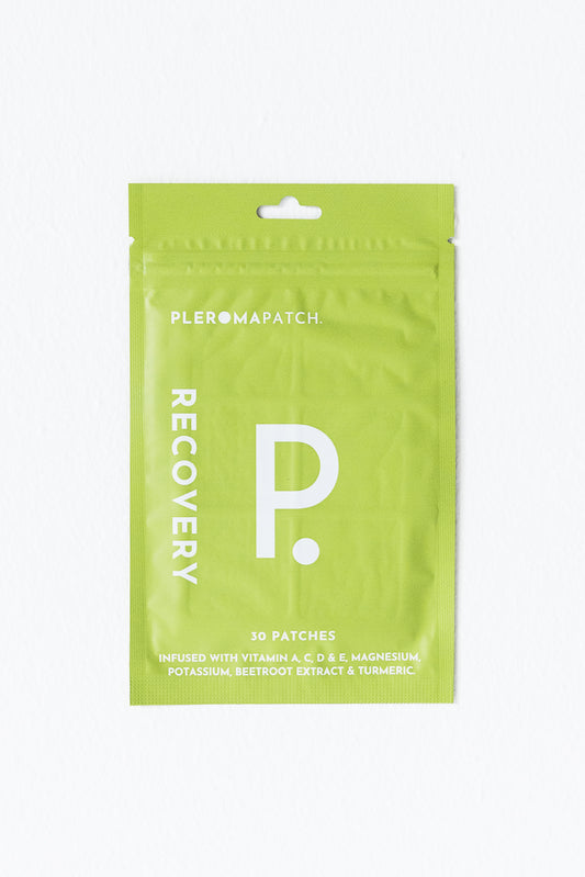 A green package of Pleroma Hangover Recovery Patches, labeled 'RECOVERY P.' with 30 patches inside, designed to alleviate hangover symptoms with a blend of vitamins and herbal extracts.